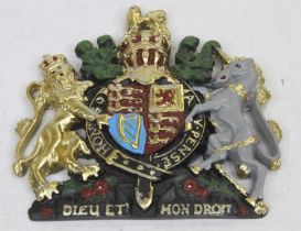 A painted composite plaque of the Royal Coat of Arms, 15 x 14cm