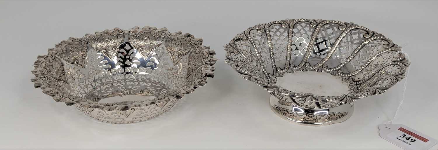 A late Victorian silver bonbon or sweetmeat dish of pierced circular form on a domed foot,