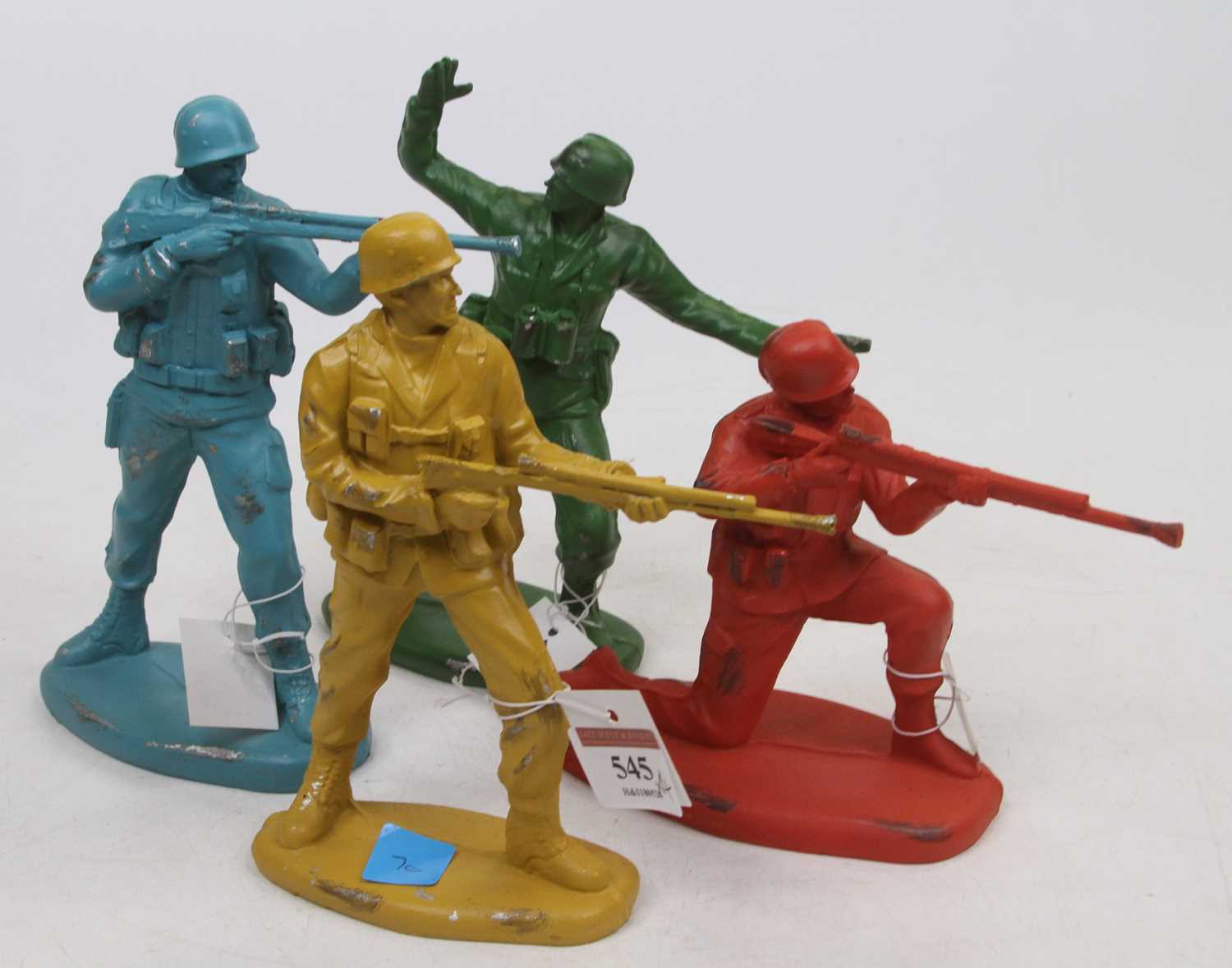 A group of four painted composite figures of toy soldiers, the largest h.18cm
