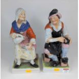 A pair of Staffordshire pottery figures of cobblers, each shown in seated pose, height 31cm