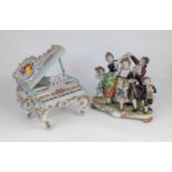 A continental porcelain figure group, children in 18th century dress, height 18cm, together with a
