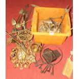 A collection of metalware, mainly toasting forks and brass fire tools