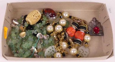 A collection of costume jewellery, to include beaded necklaces and a faux amber brooch