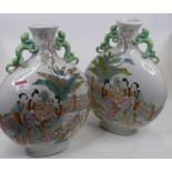 A pair of Chinese porcelain moon flasks, each enamel decorated with figures, height 34cm Both appear