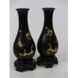 A pair of Chinese Fuzhou lacquer vases, each of baluster form, gilt decorated with dragons, height