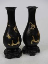 A pair of Chinese Fuzhou lacquer vases, each of baluster form, gilt decorated with dragons, height