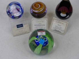 A Caithness limited edition oasis paperweight, No. 117/350, 10cm dia., together with three other