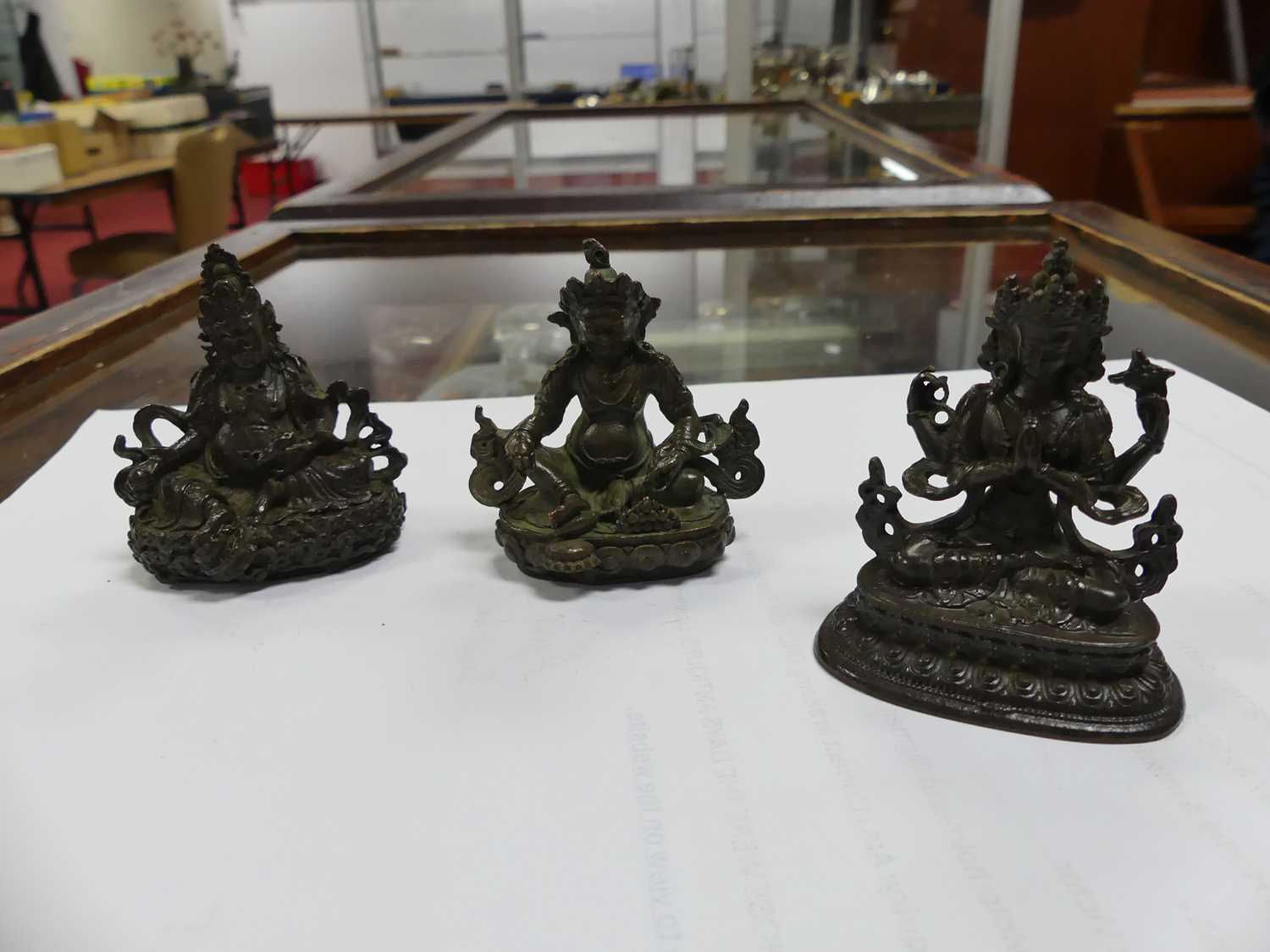 Three Chinese bronzed metal miniature Buddha figures, the largest h.5.5cm Of recent manufacture,. - Image 2 of 4