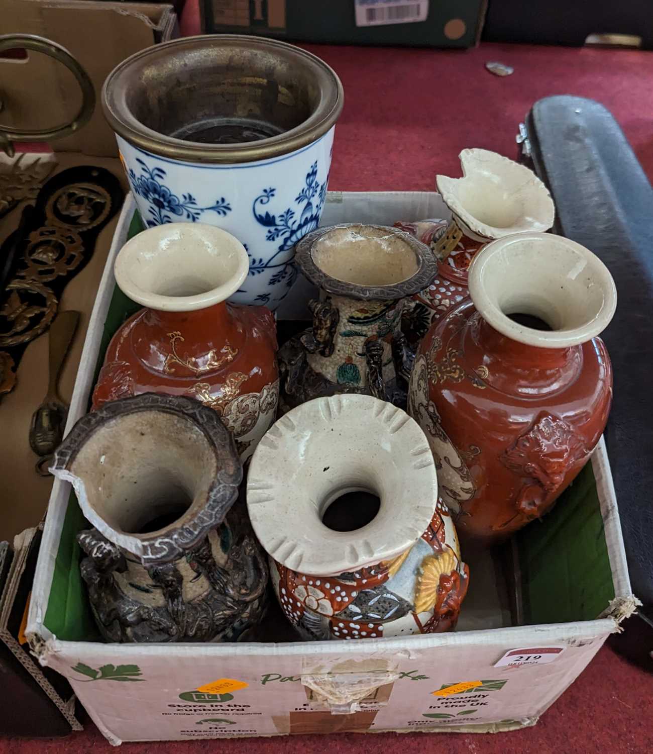 A collection of mixed Asian pottery vases, together with a blue onion pattern oil lamp base