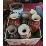 A collection of mixed Asian pottery vases, together with a blue onion pattern oil lamp base