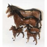 A Beswick model of a horse, chestnut gloss, height 20cm, together with four further Beswick models