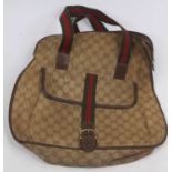 After Gucci, a monogrammed canvas tote bag, having striped webb handles