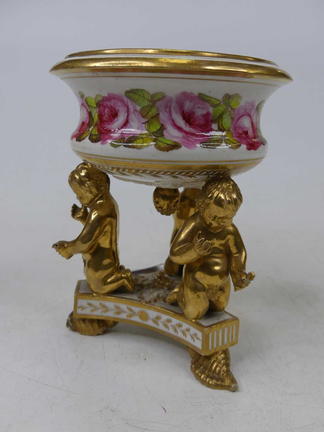 A 19th century Derby pot pourri having hand painted floral decoration, on gilt putti supports to - Image 2 of 3
