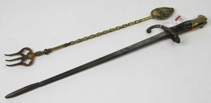 A bayonet converted to a fire poker, together with a brass toasting fork