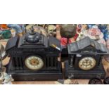 A Victorian black slate mantel clock, of architectural form, the enamel chapter ring showing