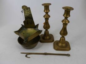 An 18th century copper cruise lamp, height 21cm, together with a pair of brass ejector candle