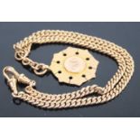 A 9ct gold curb link watch chain having twin lobster claw clasp and supporting 9ct gold and engraved