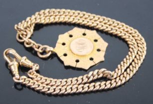 A 9ct gold curb link watch chain having twin lobster claw clasp and supporting 9ct gold and engraved