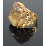 A modern 18ct gold topaz set dress ring, the four-claw set baguette cut topaz measuring approx 18.