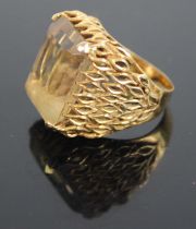 A modern 18ct gold topaz set dress ring, the four-claw set baguette cut topaz measuring approx 18.