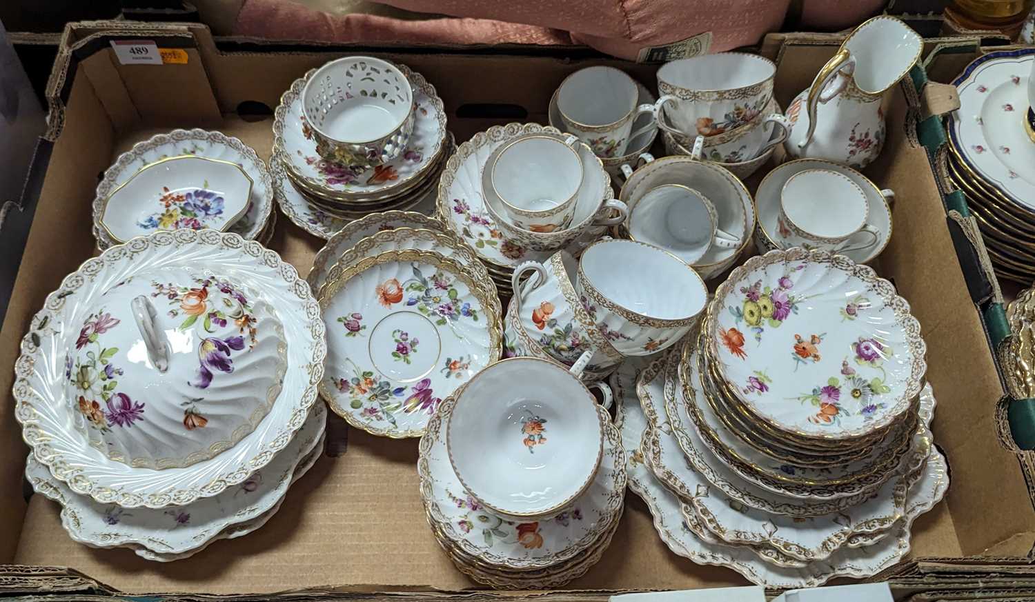 A collection of Dresden floral decorated tea wares 1 tea saucer cracked13 coffee saucers