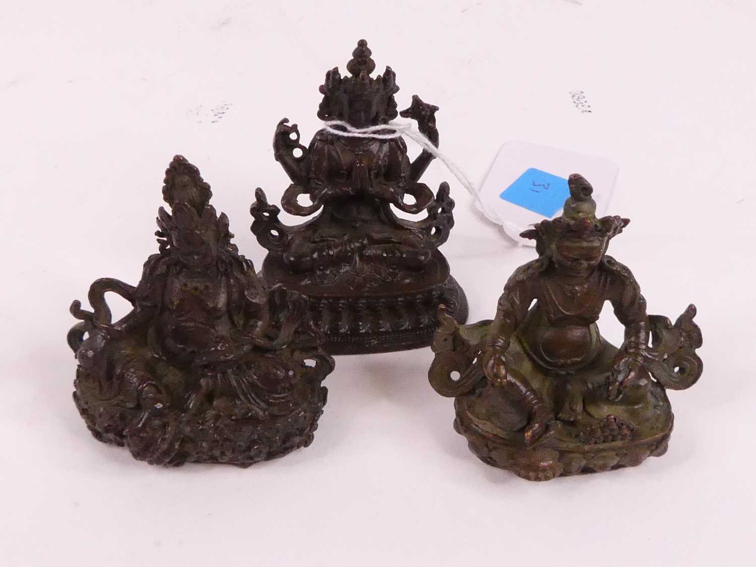 Three Chinese bronzed metal miniature Buddha figures, the largest h.5.5cm Of recent manufacture,.