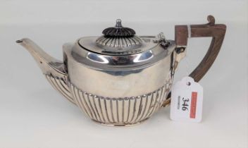 A George V silver bachelor's teapot, of half reeded oval form, maker William Hutton & Sons,
