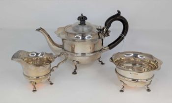 An Edwardian silver bachelor's three-piece tea service, each piece having a wavy rim to a banded