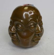 A brass four faced buddha head, height 11.5cm