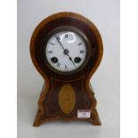 An Edwardian mahogany and satinwood crossbanded mantel clock, the enamel dial showing Roman