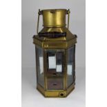 A vintage brass lantern, having swing handle and mirrored back, height 41cm Top rail of interior