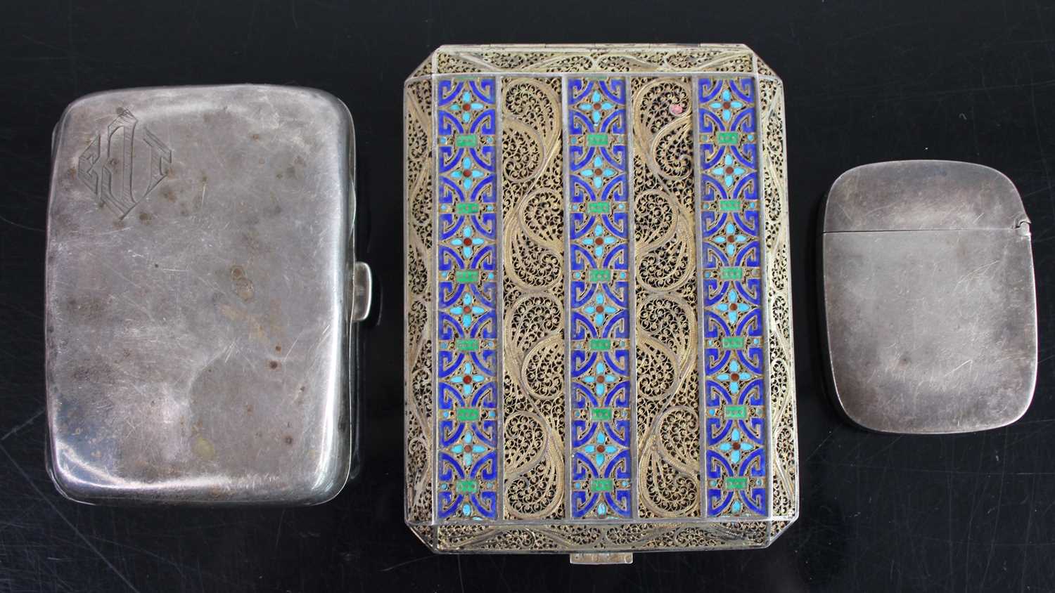 A silver pocket cigarette case; together with a silver plated vesta case; and a gilt metal and
