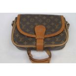 After Louis Vuitton - a monogrammed lady's handbag Condition is good overall, tarnishing to the