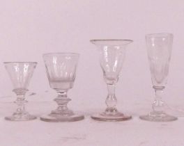 A collection of four miniature drinking glasses, possibly travelling salesmen samples, largest h.8.