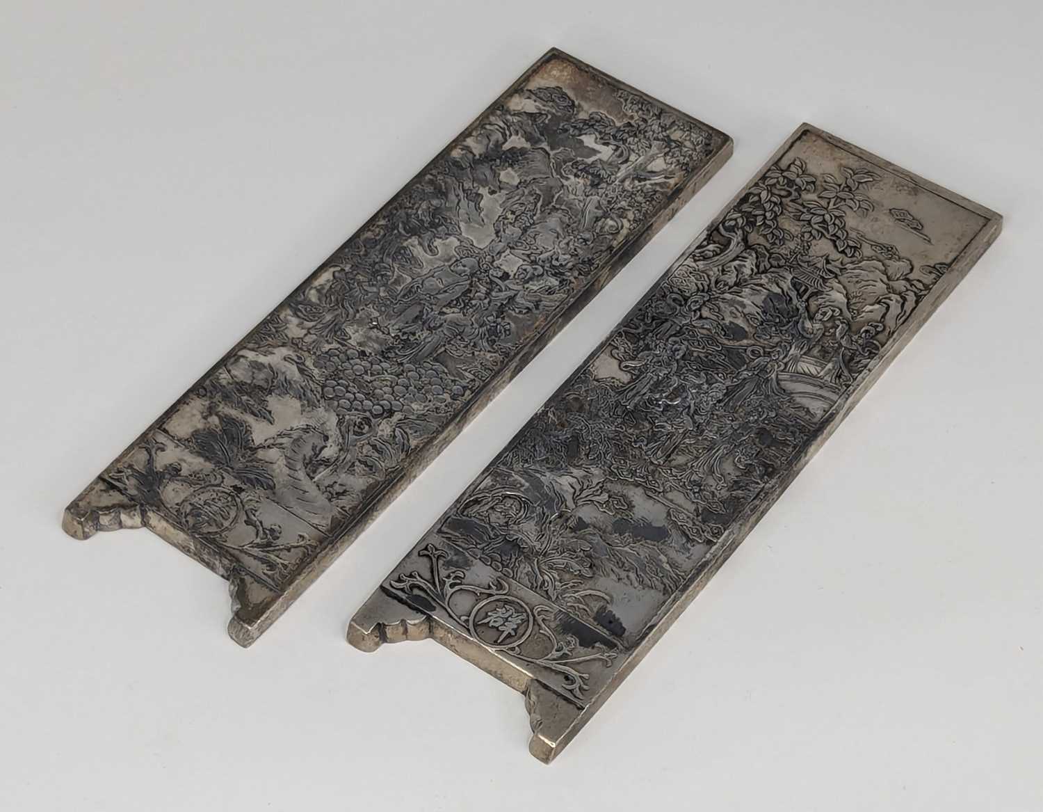A pair of Chinese export white metal panels, each relief decorated with various figures within - Image 2 of 5