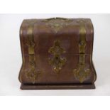 A Victorian table top box of bombe shape, in the Gothic taste, the leather clad exterior with