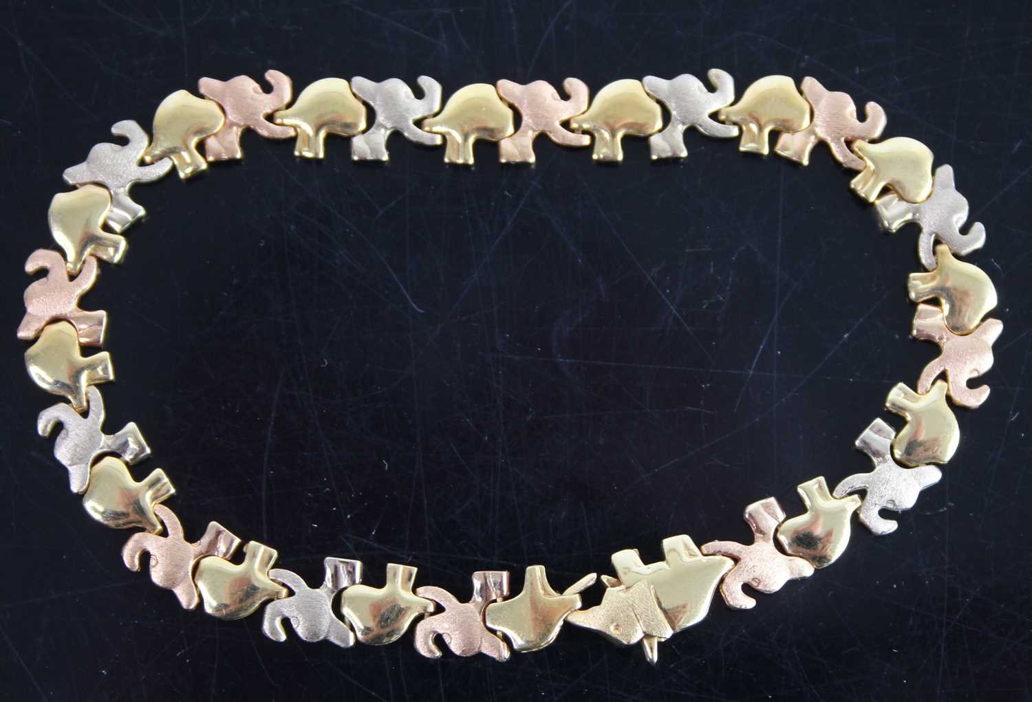 A modern 18ct yellow metal gold fancy elephant link bracelet, 10.8g, length 18.5cm, stamped 750, and