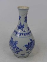 A 19th century Chinese blue & white vase of baluster shape, underglaze decorated with flowers (