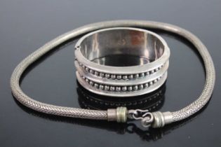 A Mexican white metal cuff bangle, stamped 925 together with heavy white metal snake link
