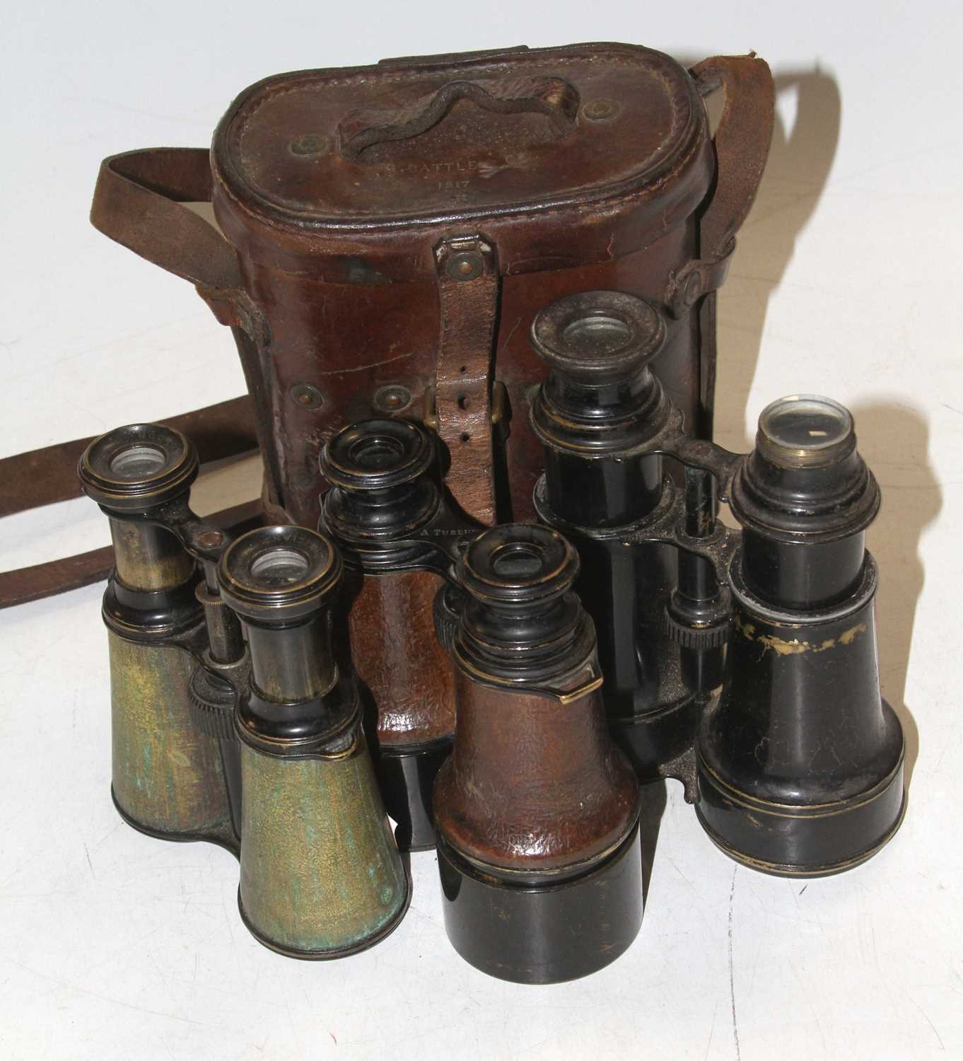 A pair of late 19th century A Tubeuf of Paris powder-coated leather-clad field binoculars, h.12cm,