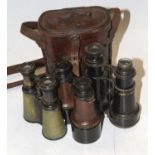 A pair of late 19th century A Tubeuf of Paris powder-coated leather-clad field binoculars, h.12cm,