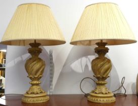 A pair of composite table lamps, each of wrythen form with acanthus leaf decoration, height