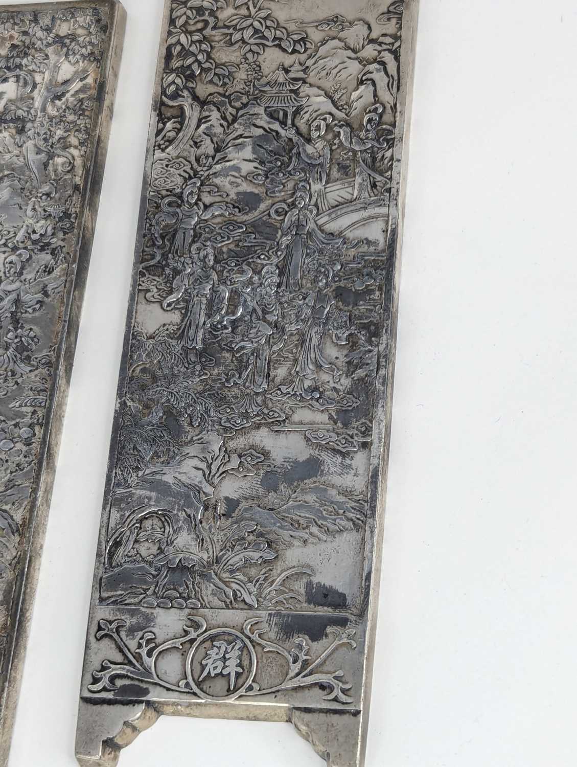 A pair of Chinese export white metal panels, each relief decorated with various figures within - Image 3 of 5