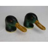 A pair of novelty painted metal bottle openers, each in the form of a duck's head, length 12cm