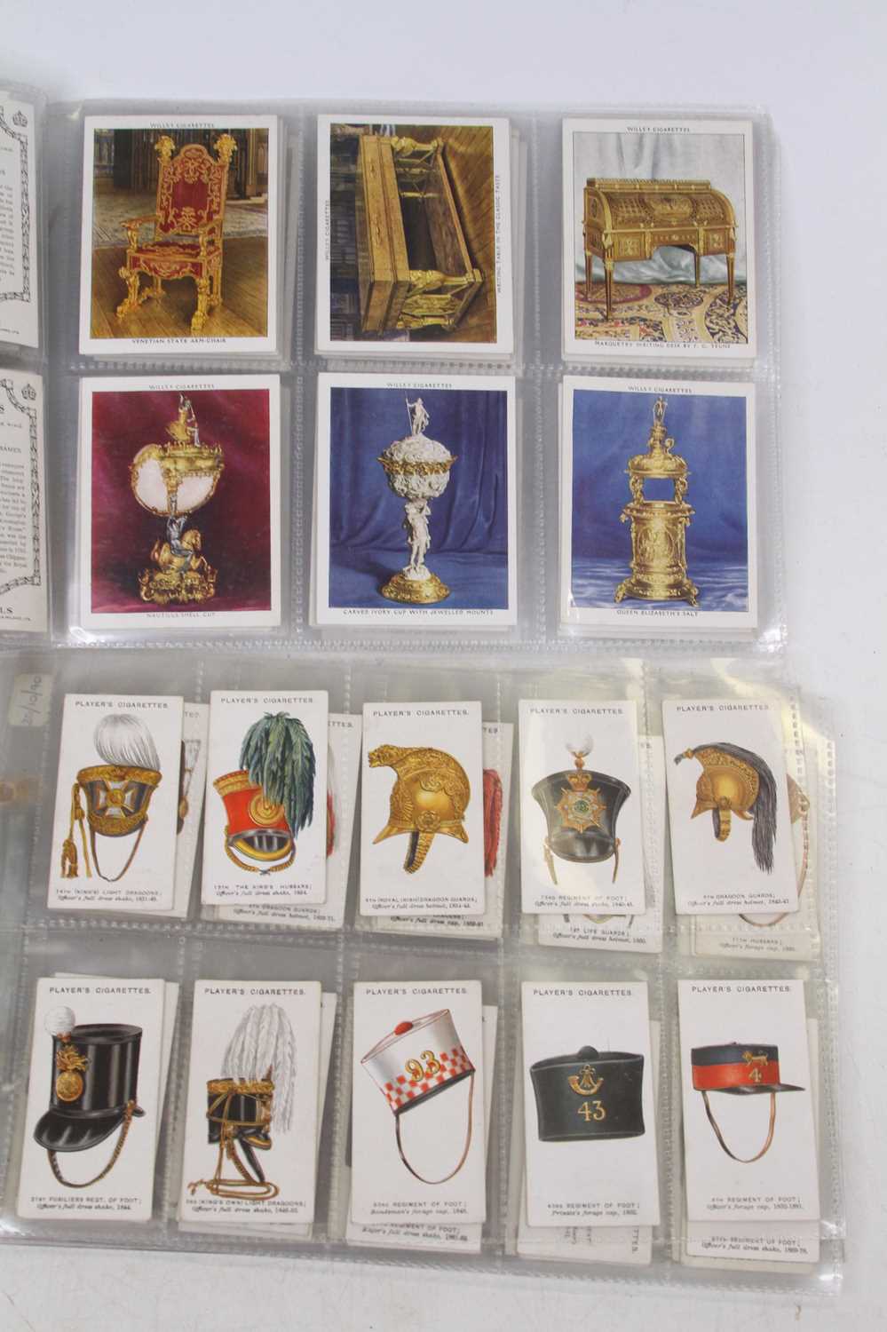 A collection of cigarette cards to include Players Cigarettes, military headdress, and Wills