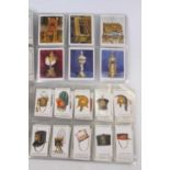 A collection of cigarette cards to include Players Cigarettes, military headdress, and Wills