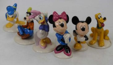 A collection of six Royal Doulton Mickey Mouse Collection figures, to include Mickey, Minnie, Pluto,