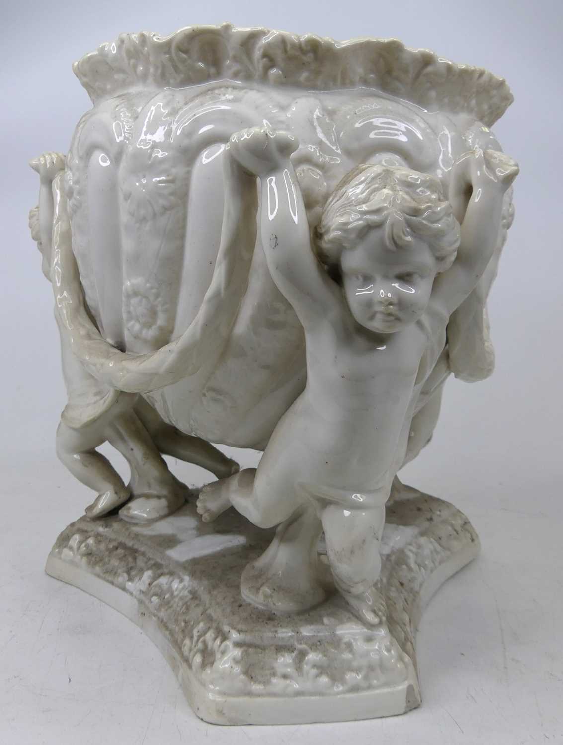 A Spode white glazed pottery jardiniere upon three figural putti supports, height 26cm, and two - Image 2 of 2