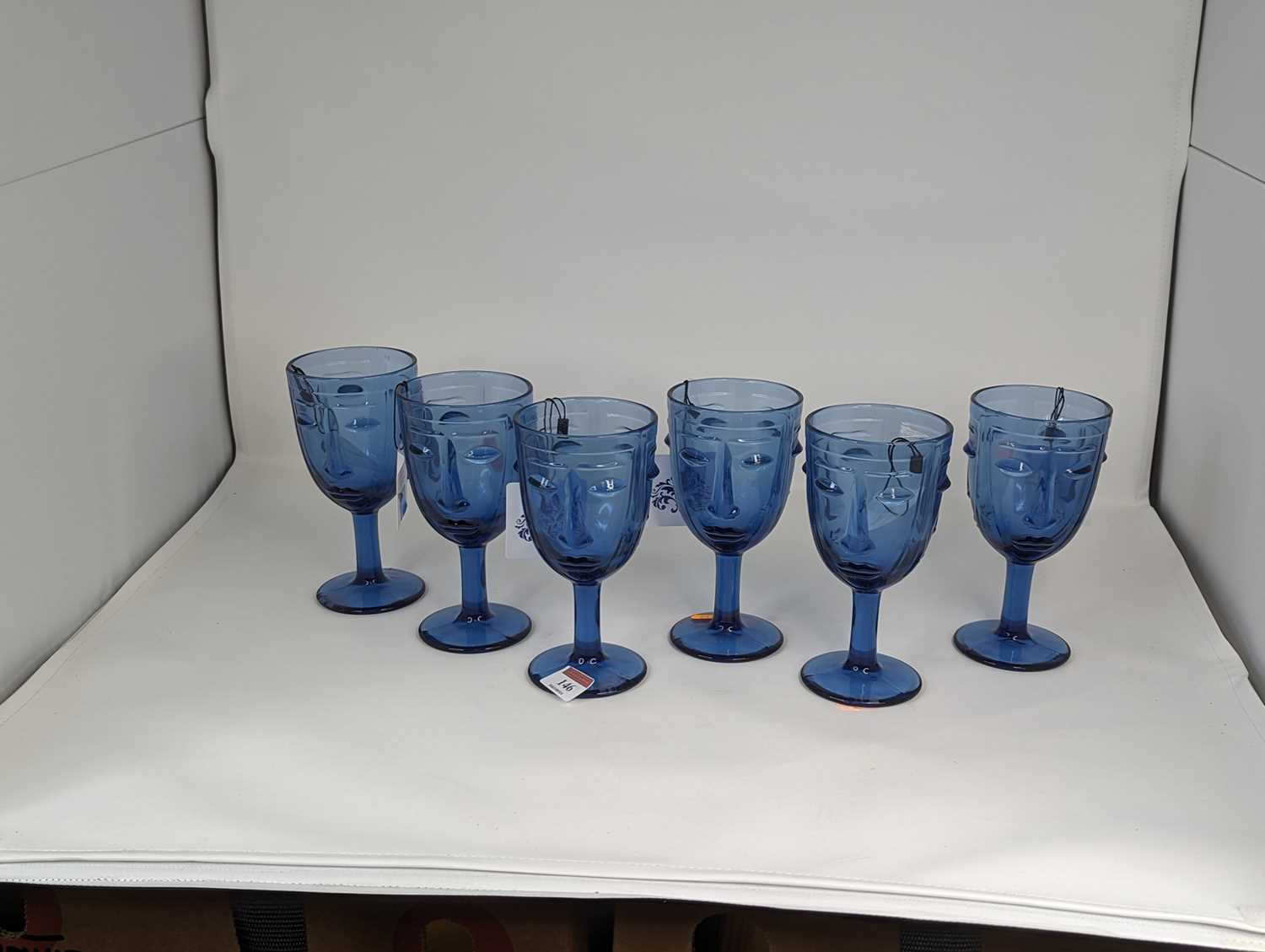 A set of six Art Deco style blue glass drinking glasses, each relief decorated with a face, height - Image 2 of 2