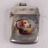 A Victorian silver vesta case of typical hinged rectangular form having porcelain roundel